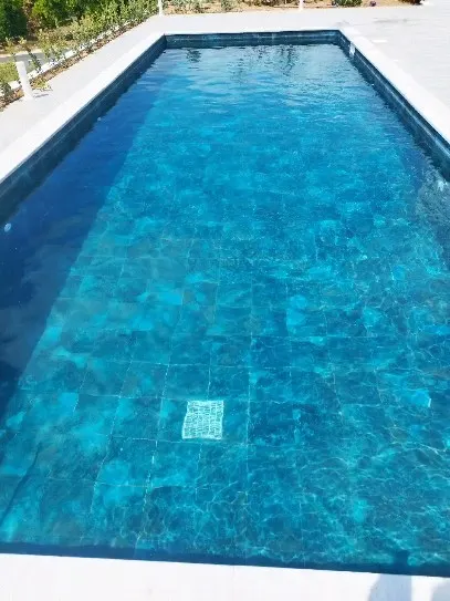 After: pool with clear turquoise water
