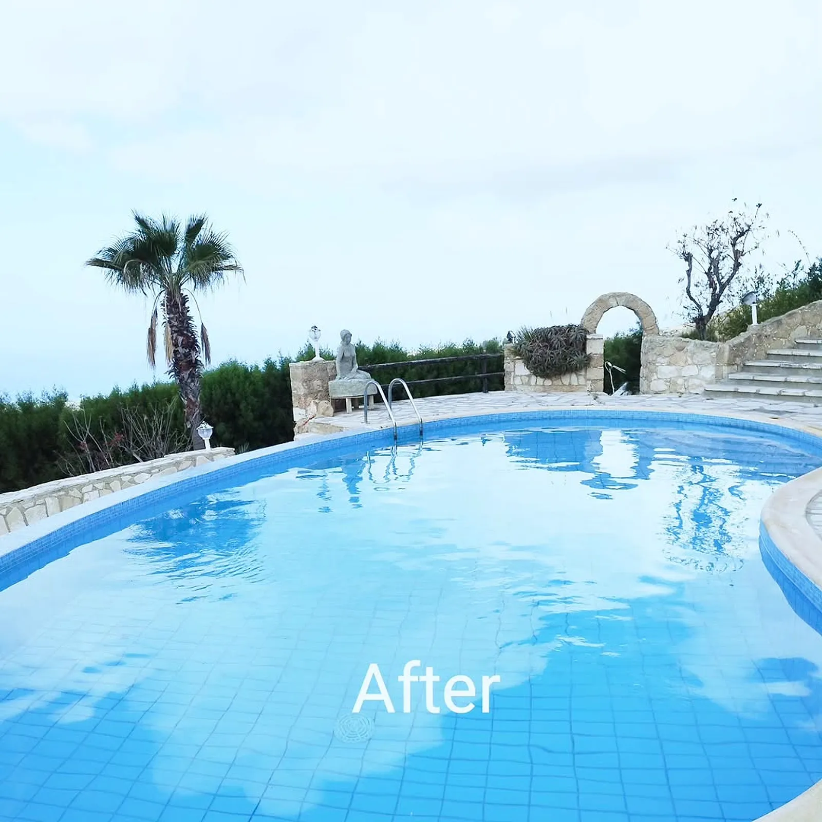 After: the renovated pool with clear blue water
